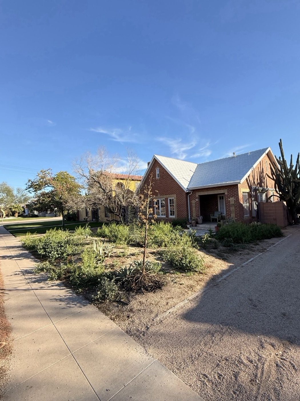 Xeriscape front yard brick house