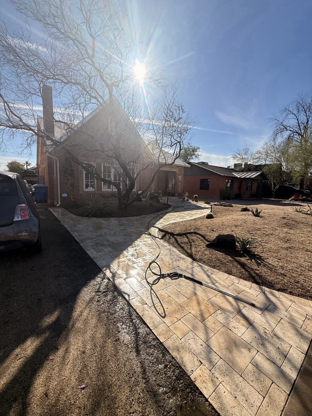 Brick house travertine driveway